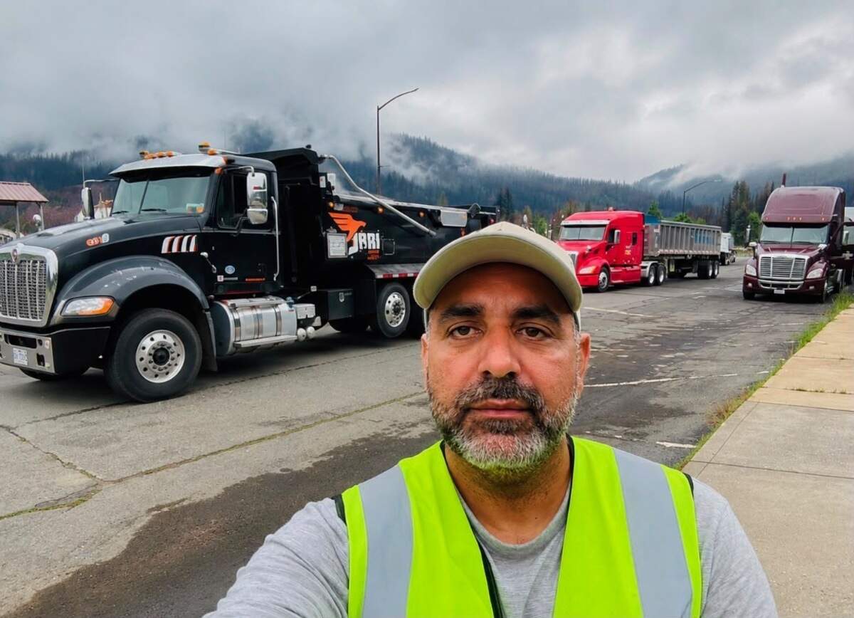 Gurinderjit Singh takes a selfie with trucks during his travels across the United States.